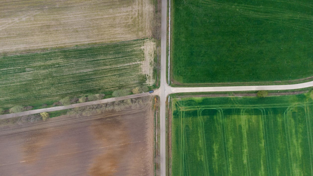 Aerial crossroads and agricultural fields showing terrain variation for topographic modeling