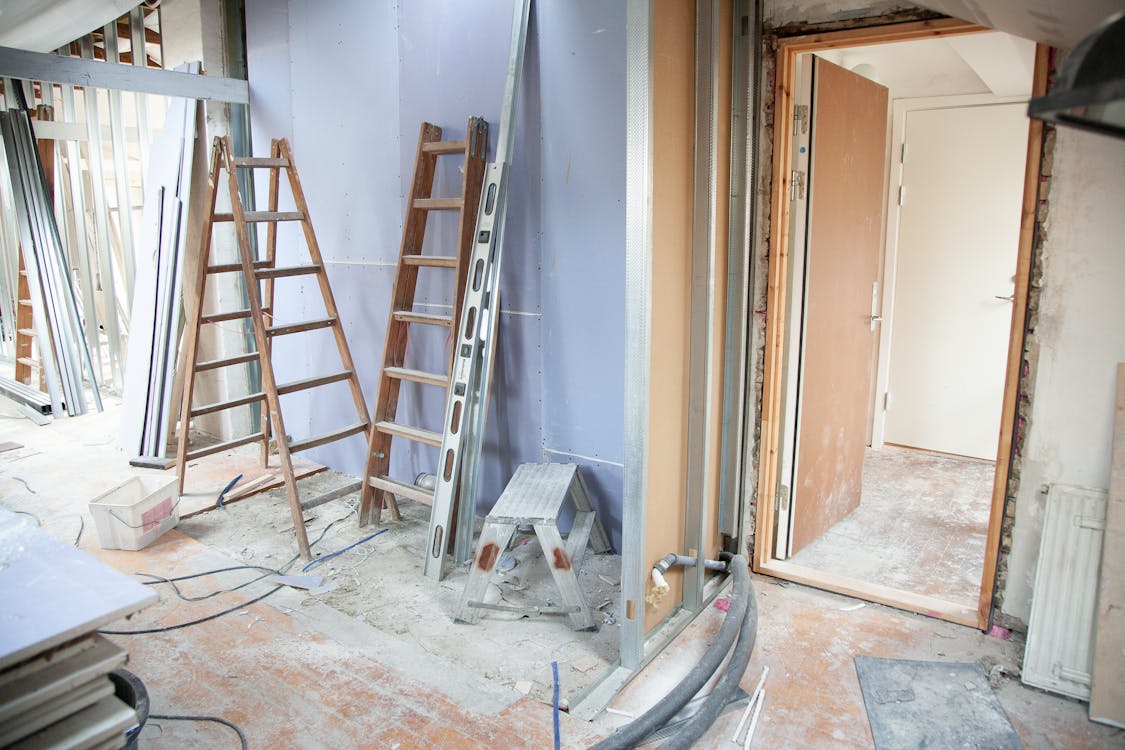 Building interior during renovation showing exposed walls and construction materials