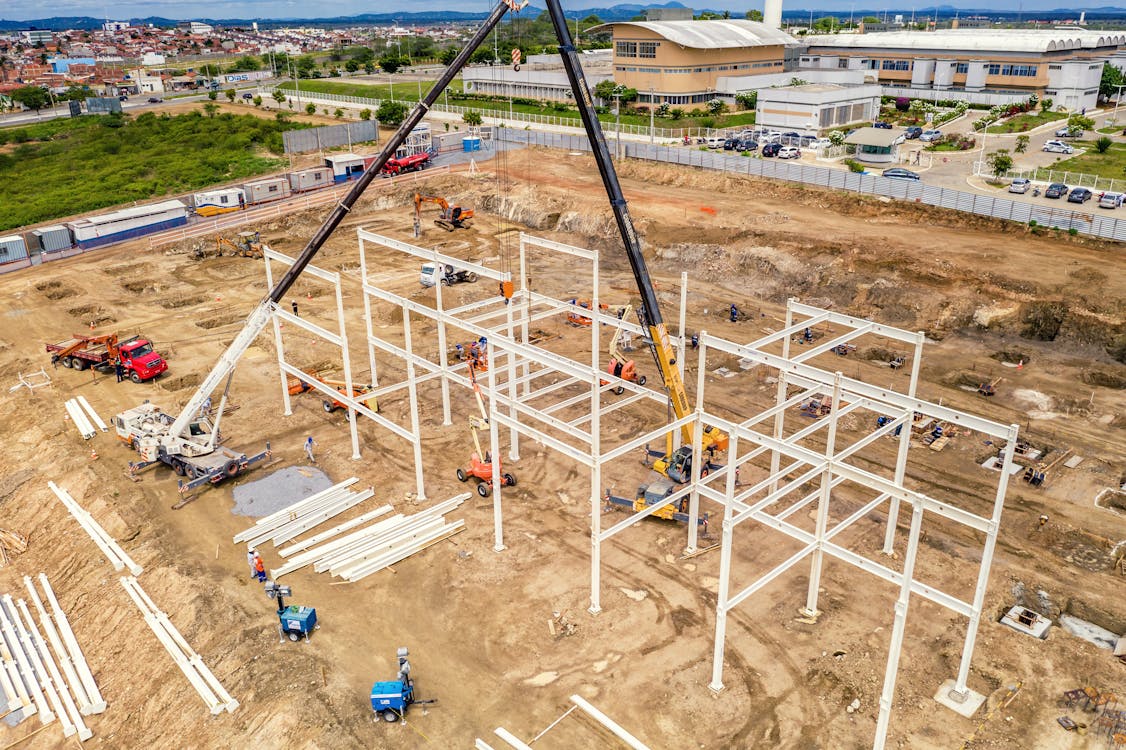 Aerial view of a construction site with crane and steel framework — a project where both orthomosaics and point clouds are used