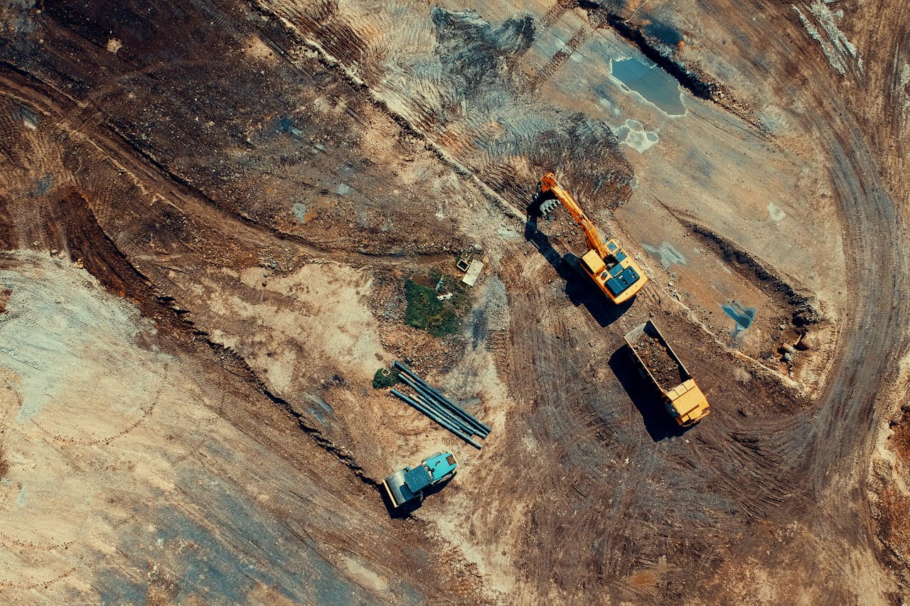 Aerial view of a construction site with equipment and vehicles