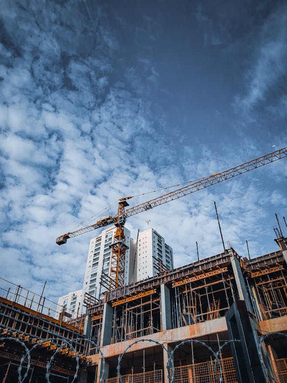 Construction site viewed from low angle showing building structure being documented