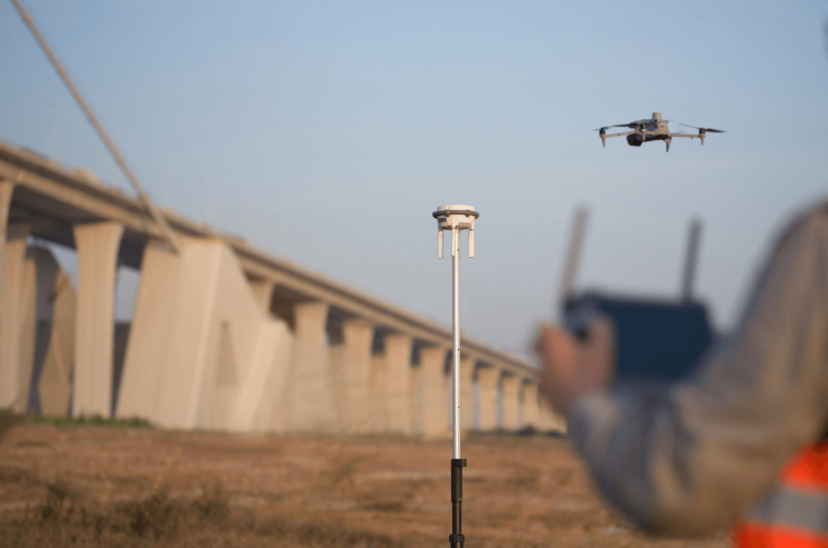 DJI Matrice 4E enterprise drone in mapping configuration — aerial LiDAR platform compared with terrestrial scanners for stadium projects