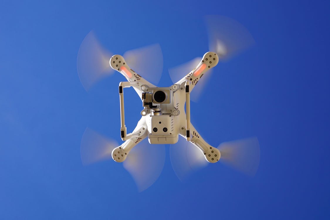 Drone flying against clear blue sky during a corridor mapping mission