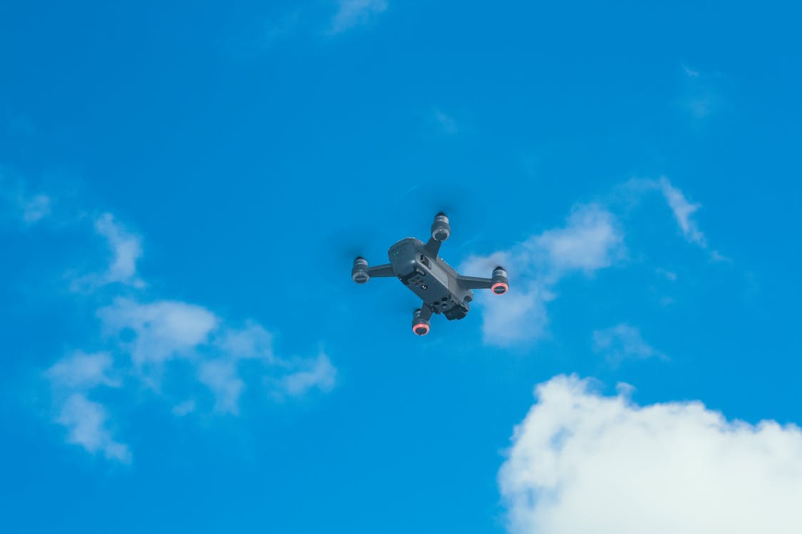 Drone quadcopter in flight capturing data for both orthomosaic and point cloud generation