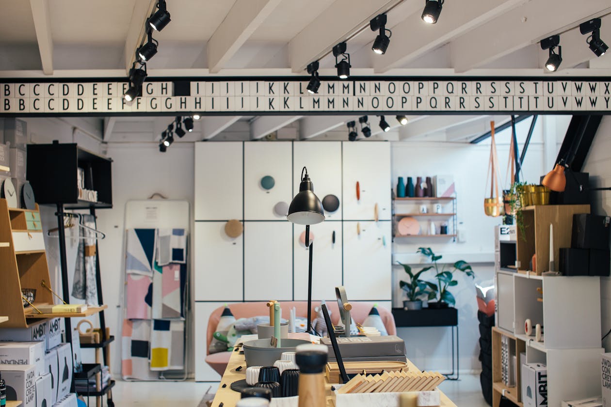 Modern design retail store interior with track lighting, product displays, and decorative home goods — retail showrooms can showcase their inventory layout through virtual tours