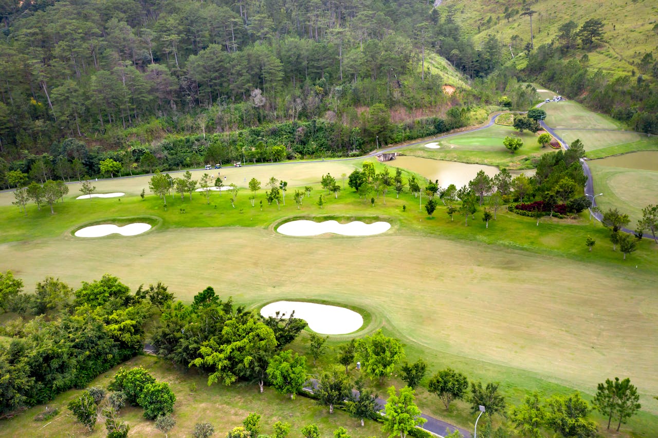 Aerial view of golf course showing bunkers and varied terrain — the existing conditions that LiDAR surveys capture for renovation design