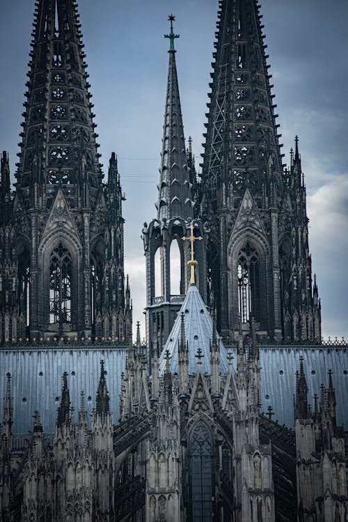 Gothic cathedral facade in Cologne showing intricate heritage architectural stonework
