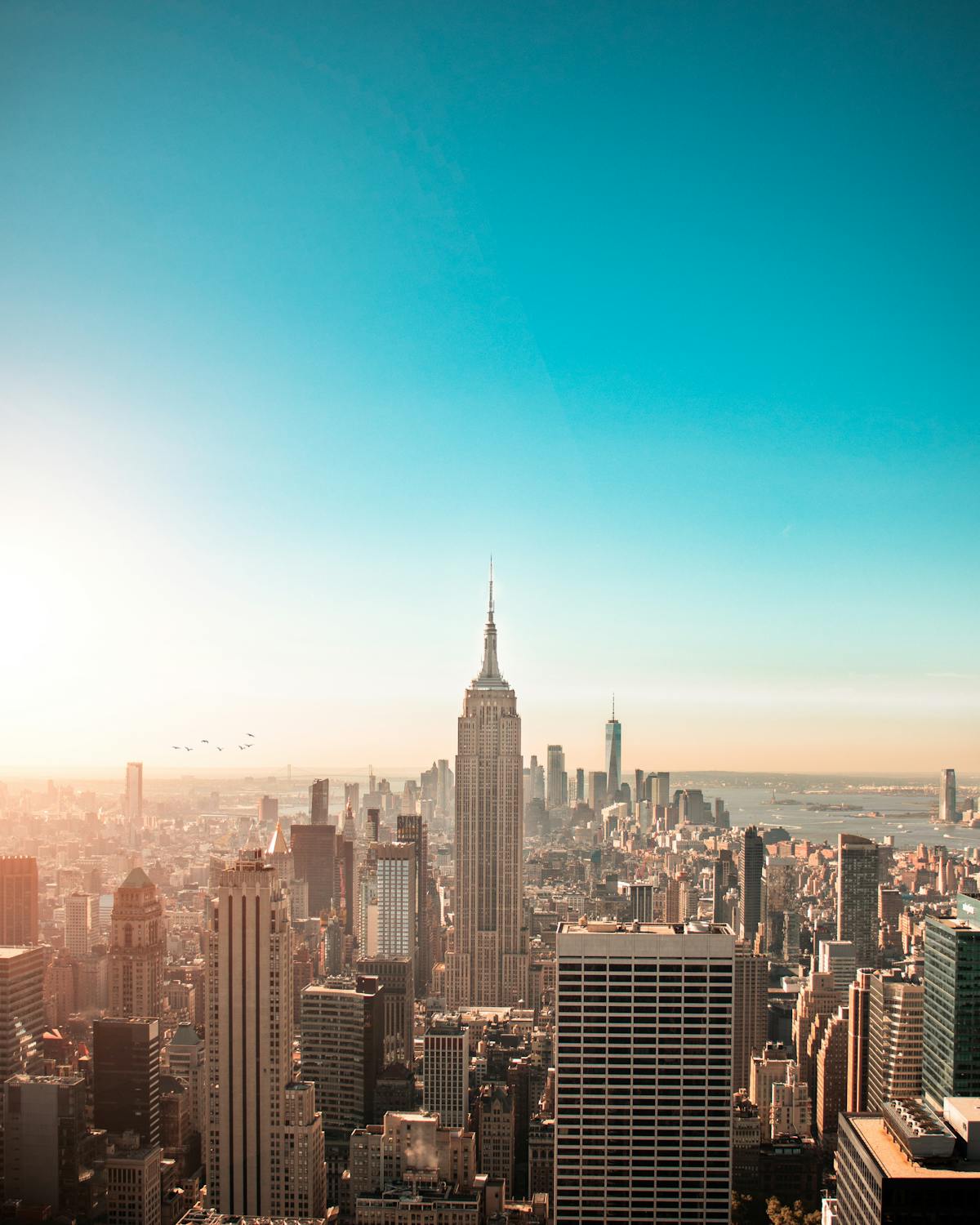 Aerial cityscape view of dense urban architecture with historic skyscrapers and modern buildings