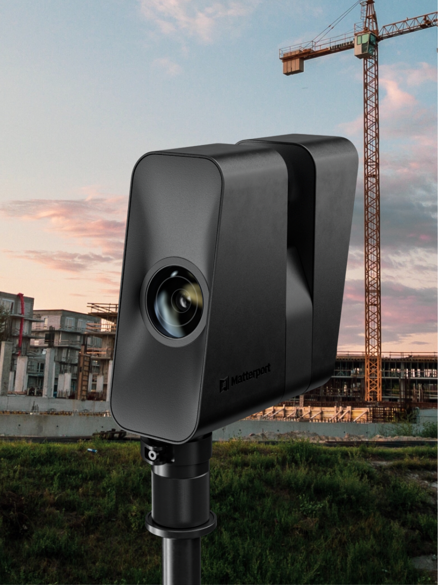Matterport Pro3 camera mounted on tripod at a construction site with cranes in the background, demonstrating outdoor scanning capability