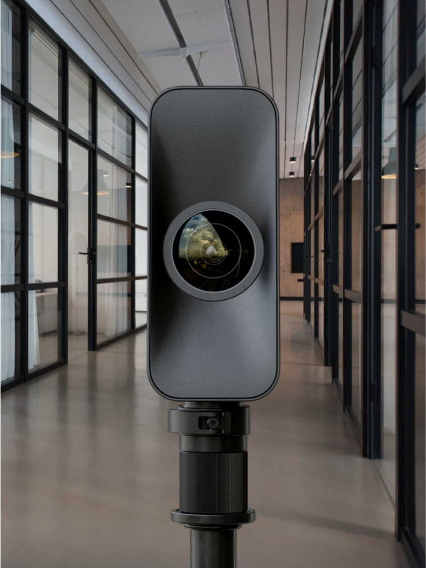 Matterport Pro3 camera on a tripod scanning a modern hallway with glass walls and natural lighting