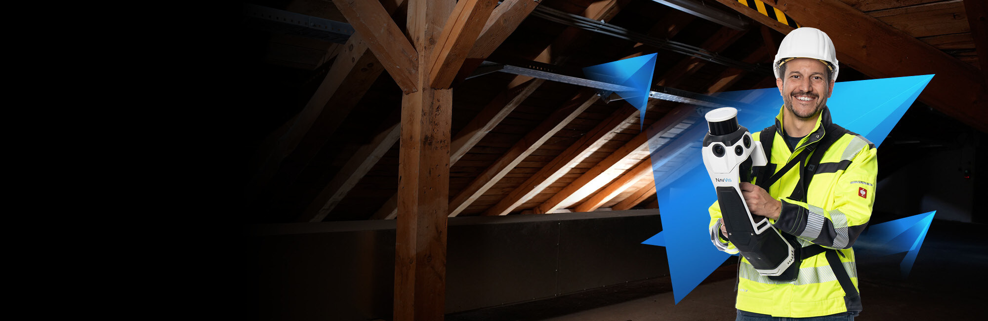 Operator holding the NavVis MLX handheld scanner in a tight attic space — demonstrating the compact form factor for confined area scanning