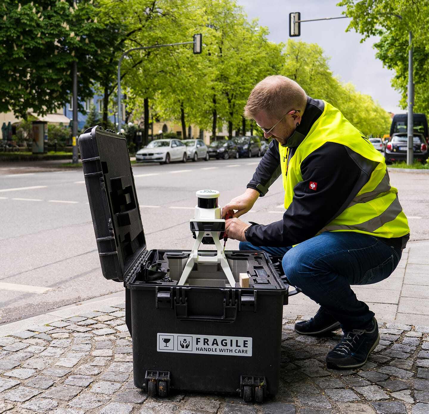 NavVis VLX3 mobile laser scanner being set up from its transport case for an indoor scanning mission