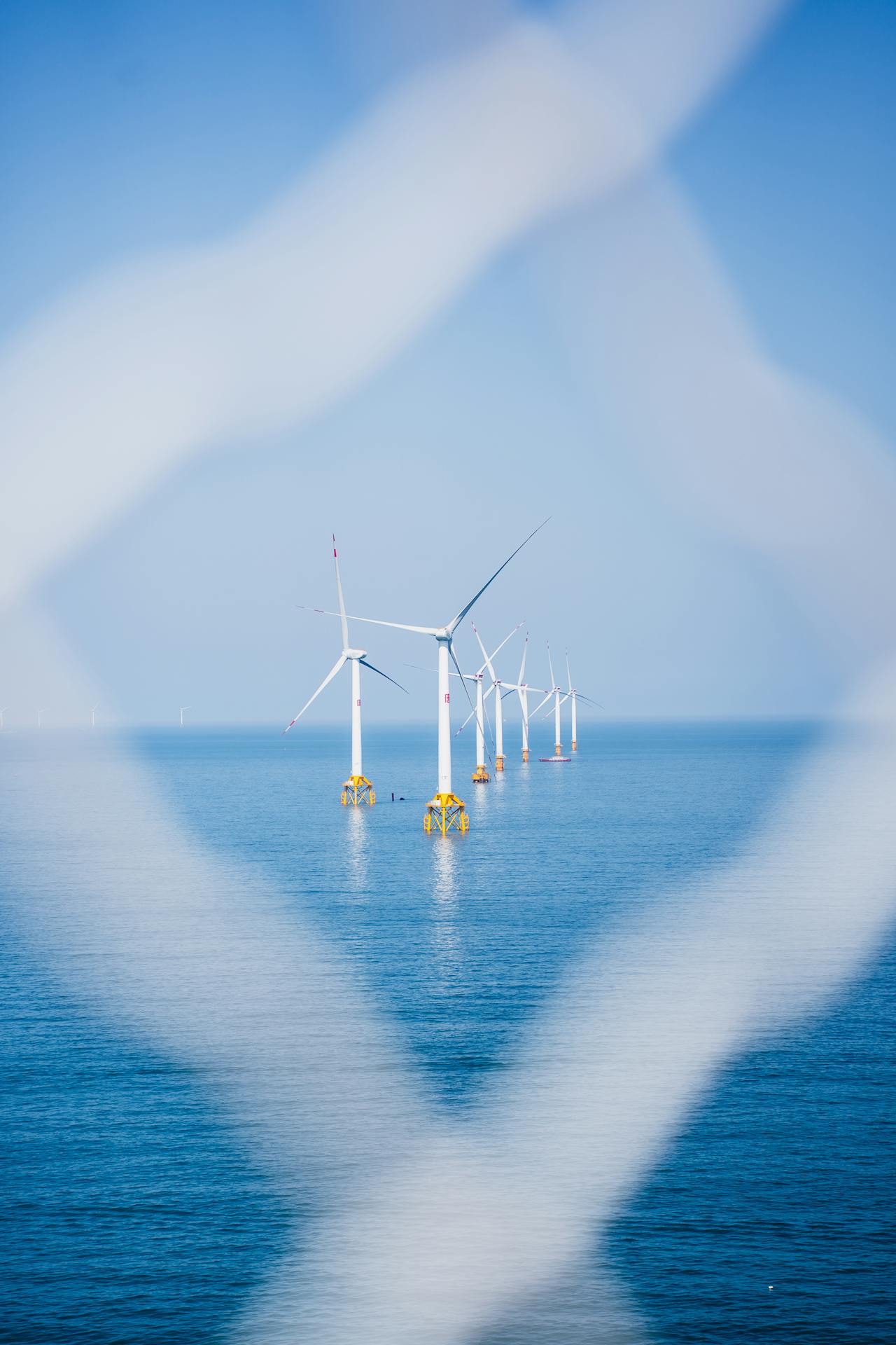 Offshore wind turbines representing harsh weather environments where dock-based drones operate