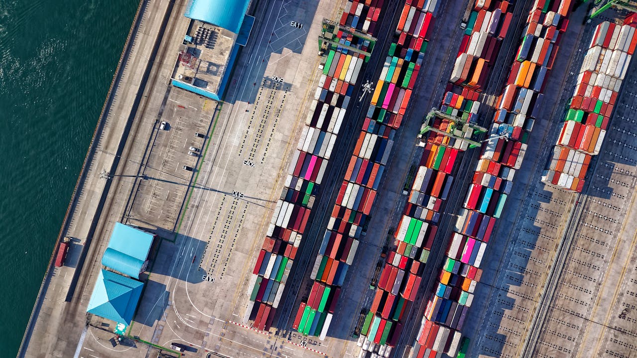 Aerial view of a container port with colorful shipping containers — port infrastructure requires combined above-water and below-water 3D documentation