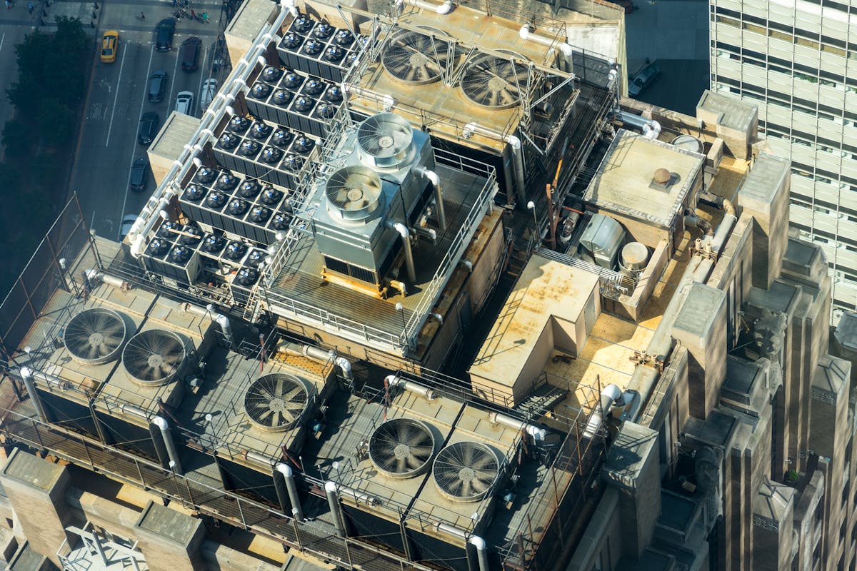 Aerial view of complex rooftop HVAC and mechanical systems on a commercial building