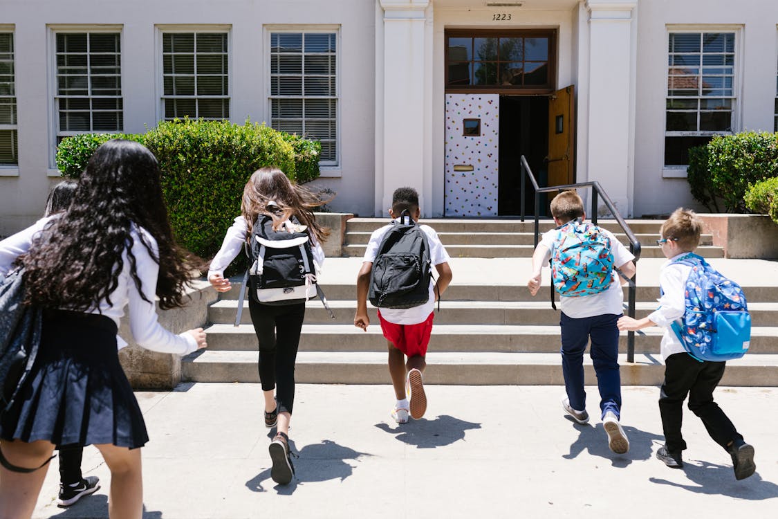 Students entering a school building