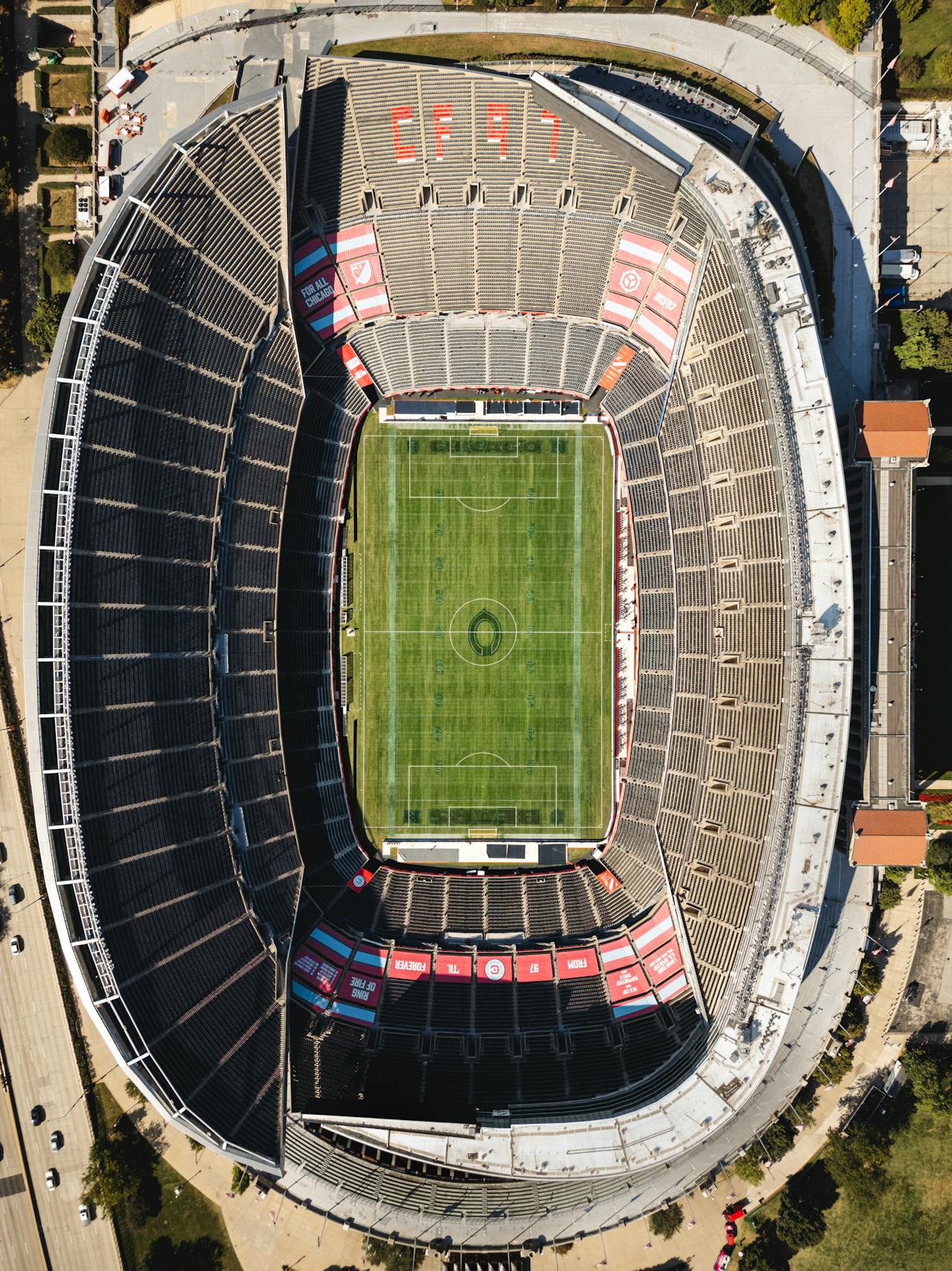 Aerial top-down view of a large empty football stadium — illustrating the massive scale of stadium scanning projects