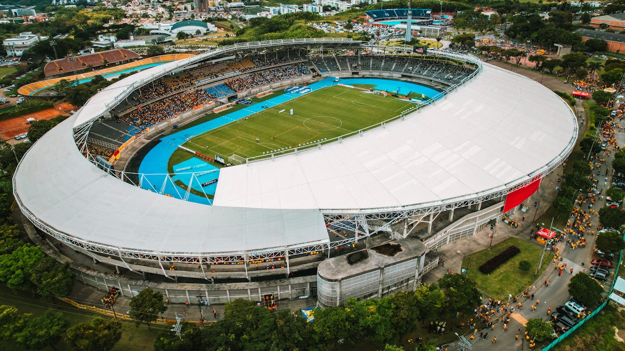 Aerial view of a modern football stadium with distinctive roof structure — representative of FIFA 2026 World Cup host venues
