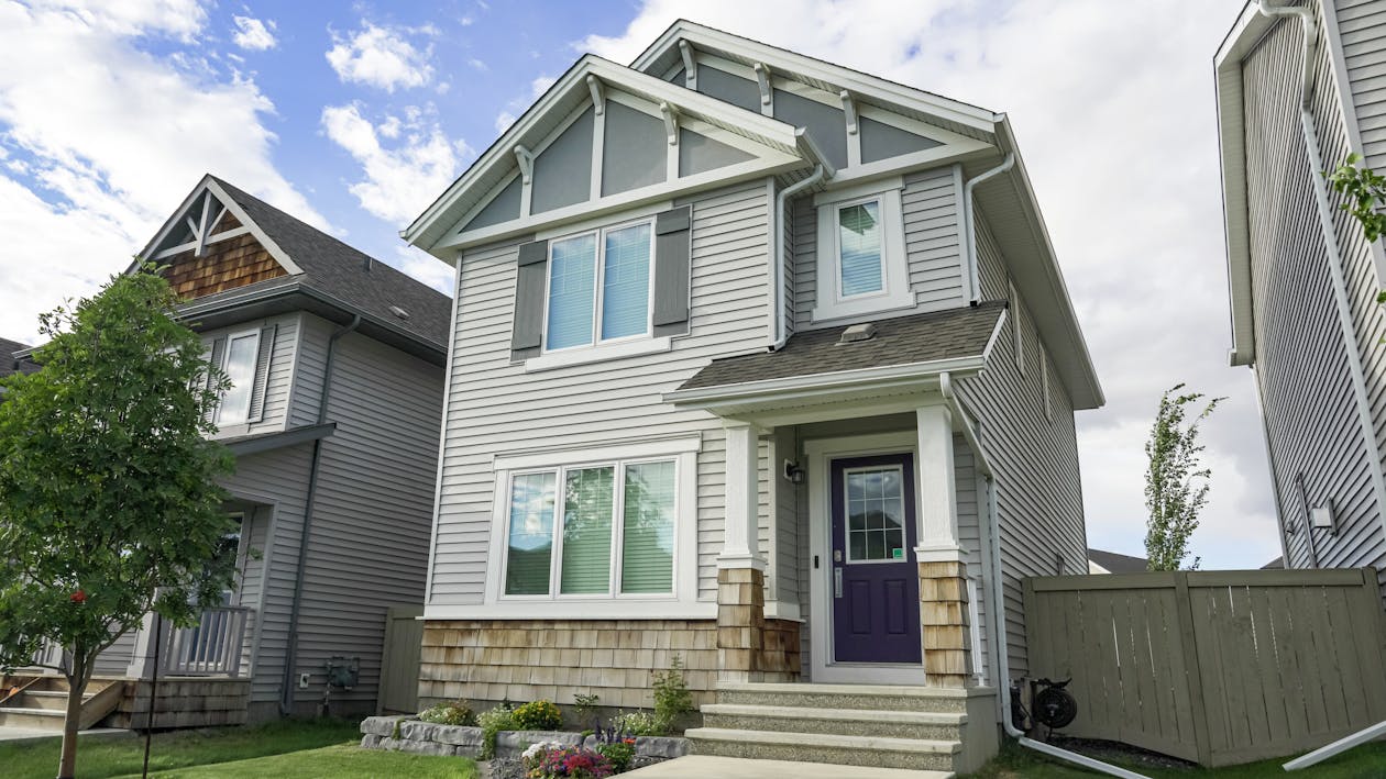Modern suburban house facade representing residential scan processing costs