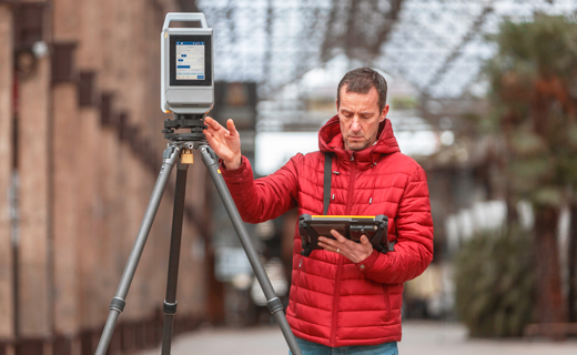 Trimble X12 3D laser scanner in use on a construction site for quality verification