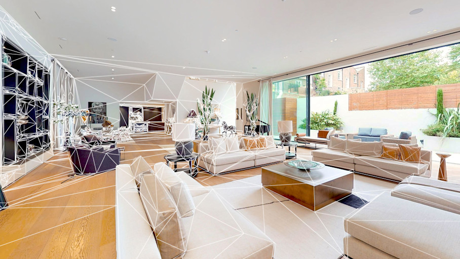 Matterport 3D wireframe mesh overlay on a luxury living room showing how spatial data is captured
